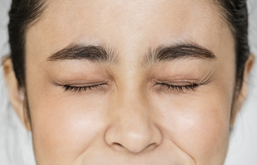 Closeup of Young Asian girl portrait eyes closed