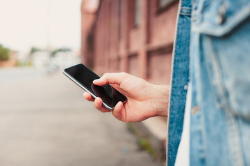 Close up of a man using mobile smart phone.