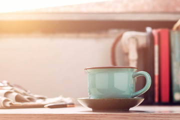 Cup of coffee on desk.