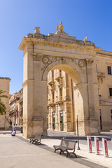 Noto, Sicily, Italy. The Royal Gate is a monumental entrance to the city in the form of a triumphal arch erected in the 19th century