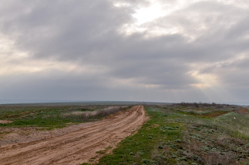 unpaved country road in spring steppe near Elista Republic of Kalmykia, Russia	