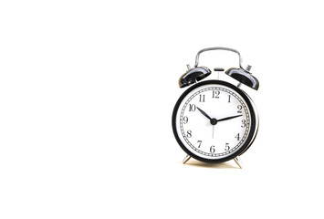 White light over Image of Black Alarm Clock classic vintage style. Isolated on white background and copy space.