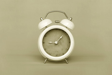 Image retro vintage style of Old Alarm Clock analog classic on paper retro background.