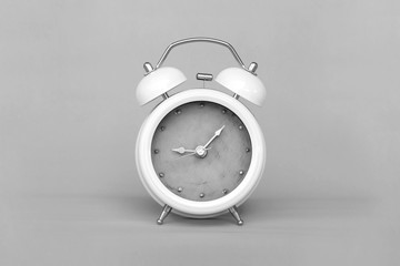 Black and white picture of Old Alarm Clock analog classic vintage style on paper retro background.