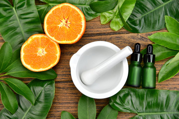 Natural organic medicine and healthcare, Alternative plant medicine, Mortar and orange slices vitamin-c extract.