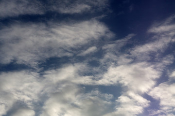 Obraz premium Blue sky with fleecy clouds, may be used as background .