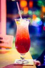Cocktail on table, New Year, Christmas light decoration.