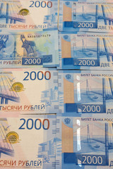 background of the new banknotes worth 2000 rubles .