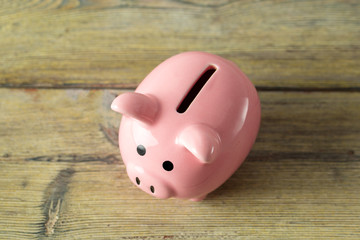 piggy bank on the old wooden background