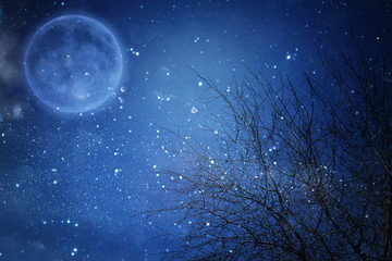 Fototapeta na wymiar Surreal fantasy concept - full moon with stars glitter in night skies background.