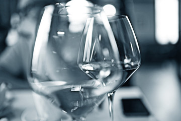 Wine-glasses on the table blurred
