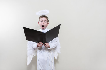 Boy angel singing in the choir