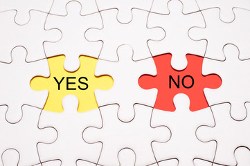 Fototapeta premium White blank puzzle with text YES or NO.