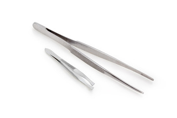 Two different steel tweezers on a white background