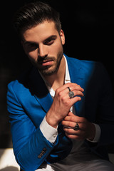 happy handsome elegant man touching hands