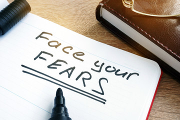 Face your fears written in a note.