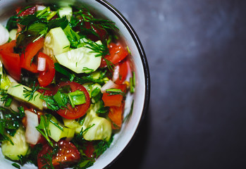 Close up salad of fresh tomatoes and cucumbers. Healthy food, vegetables.
