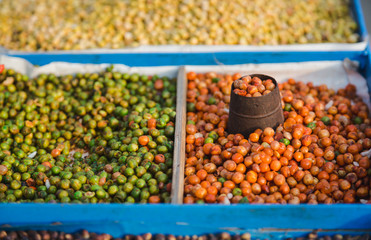 Street Food ,fried Soybean,Corn,Nuts etc with mesurement pot in the street of Nepal.