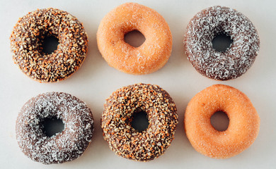 Various donuts on white background. Top view.