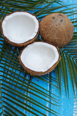 Coconut isolated on the wooden background. Tropical fruit coconut