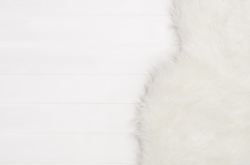 White planks with wood texture pattern and fur background with copy space. Horizontally oriented...