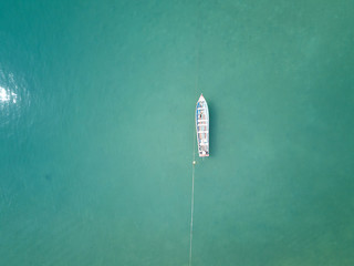 Aerial View. Top view of a small boat moored on a beach