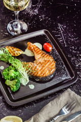 salmon stak with salad