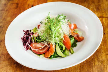 vegetable salad on wood background