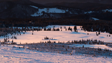 A beautiful sunrise on top of Calimani mountains in Romania during a very cold but sunny winter morning.