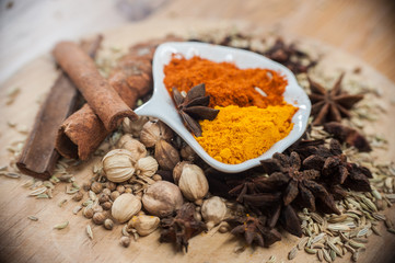 Various spices and herbs on wooden table