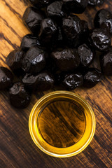 Close up of black olives and olive oil