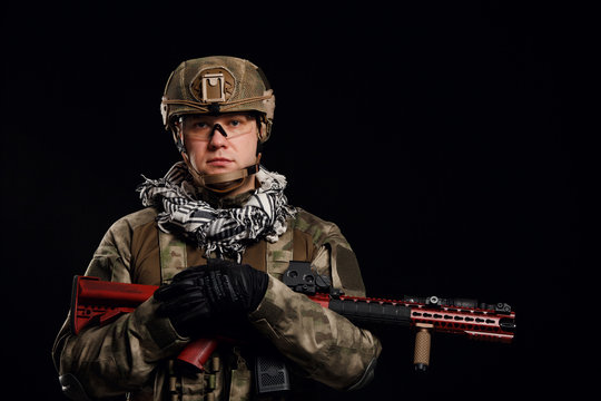 Photo of soldier in helmet with gun