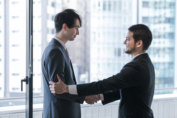 Two businessman shaking hands. Partnership of business concept.