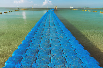Plastic floating bridge pier for tourist on the beach at Koh Larn,Pattaya,Thailand.