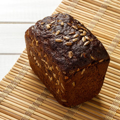 rye bread with seeds on bamboo napkin