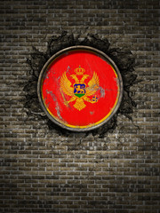 Old Montenegro flag in brick wall