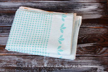 top view of tablecloth on brown wooden table
