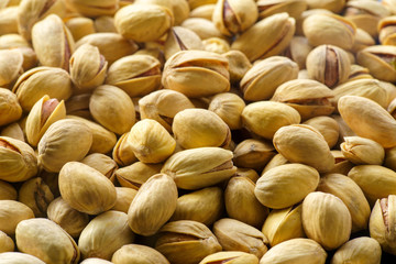 Pistachio nuts. A close-up photograph. Unrefined whole kernel 
