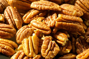 Pecans nuts. A close-up photograph. Unrefined whole kernel