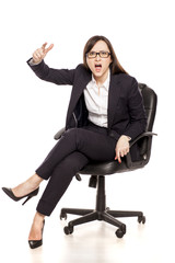 angry businesswoman in armchair shouting on white background