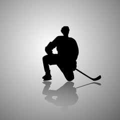 Vector image of a hockey player sitting on one knee with a mirror shadow on a gray background. Flat