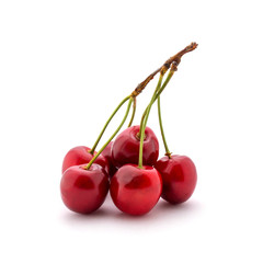 Photo of red cherries with tails isolated on white background