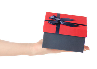 Gift box with a red lid and a blue bow in hand