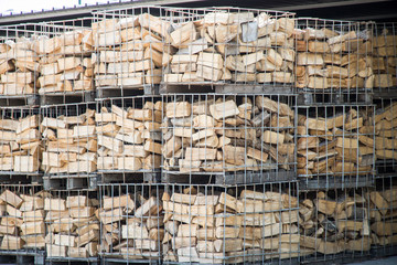 Firewood in metal containers;