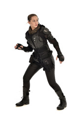 Fototapeta premium full length portrait of female soldier wearing black tactical armour, isolated on white studio background.