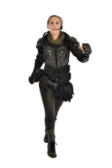 Fototapeta premium full length portrait of female soldier wearing black tactical armour, isolated on white studio background.
