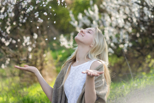 Beautiful young teen girl outdoors enjoy nature in springtime