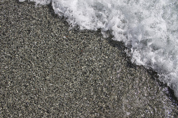 Ocean water surging in over sand beach. Nice colors and details. - 193942938