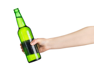 female hand with green beer bottle