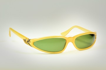 Beautiful vintage yellow sunglasses closeup isolated on white. Years 1960s.